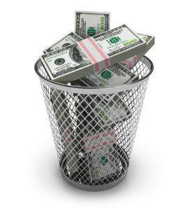 Dollars in the trash bin