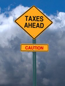 caution taxes ahead post sign