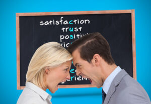 Composite image of colleagues quarreling head against head